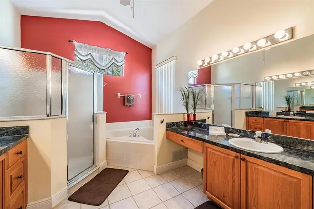 a bathroom with a sink a mirror and a bathtub