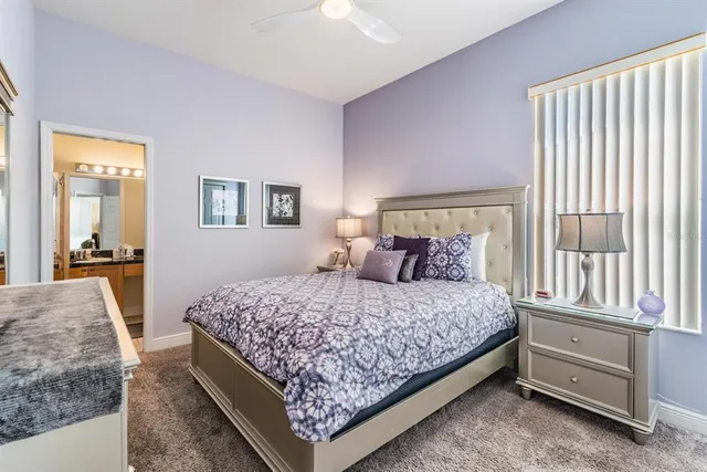 a bedroom with a large bed and a couch