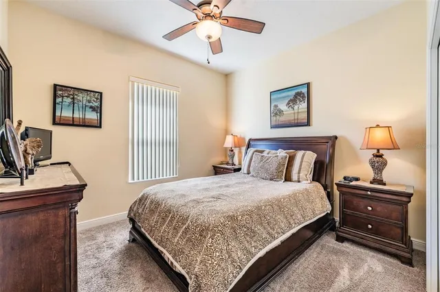 a bedroom with a bed and a desk