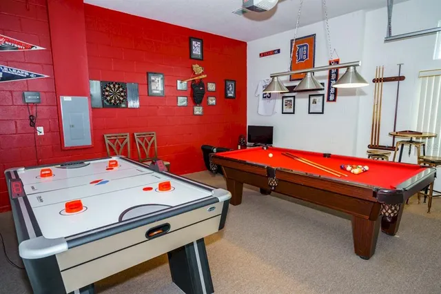 a blue bed sitting in a bedroom next to a window