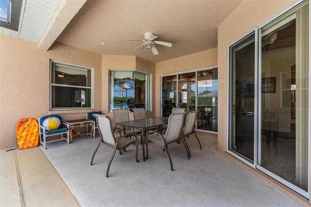 a view of a chairs and table in the backyard