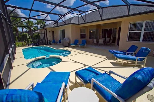 a view of a swimming pool with a patio