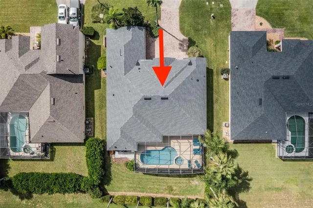 an aerial view of a house with outdoor space