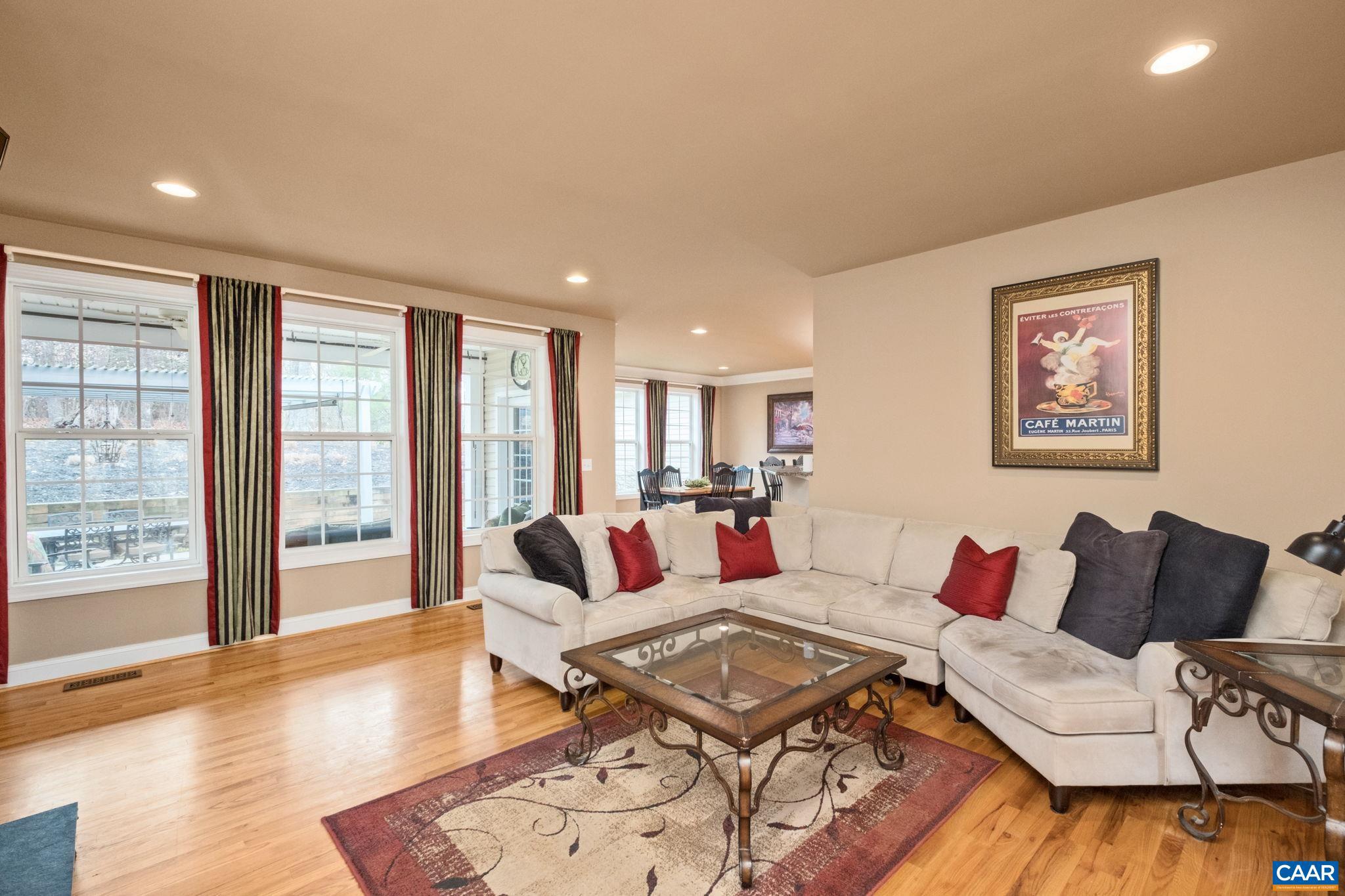 612 London Court Ruckersville, VA 22968 - Photo 11 of 55 a living room with furniture and a wooden floor
