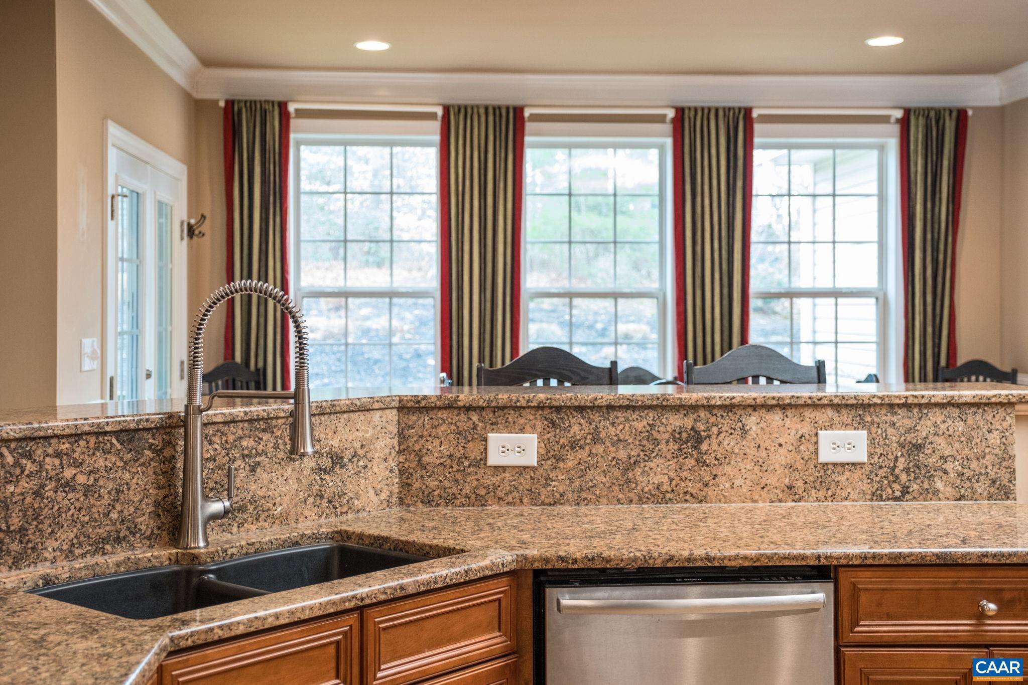 612 London Court Ruckersville, VA 22968 - Photo 14 of 55 a kitchen with granite countertop a sink and a window