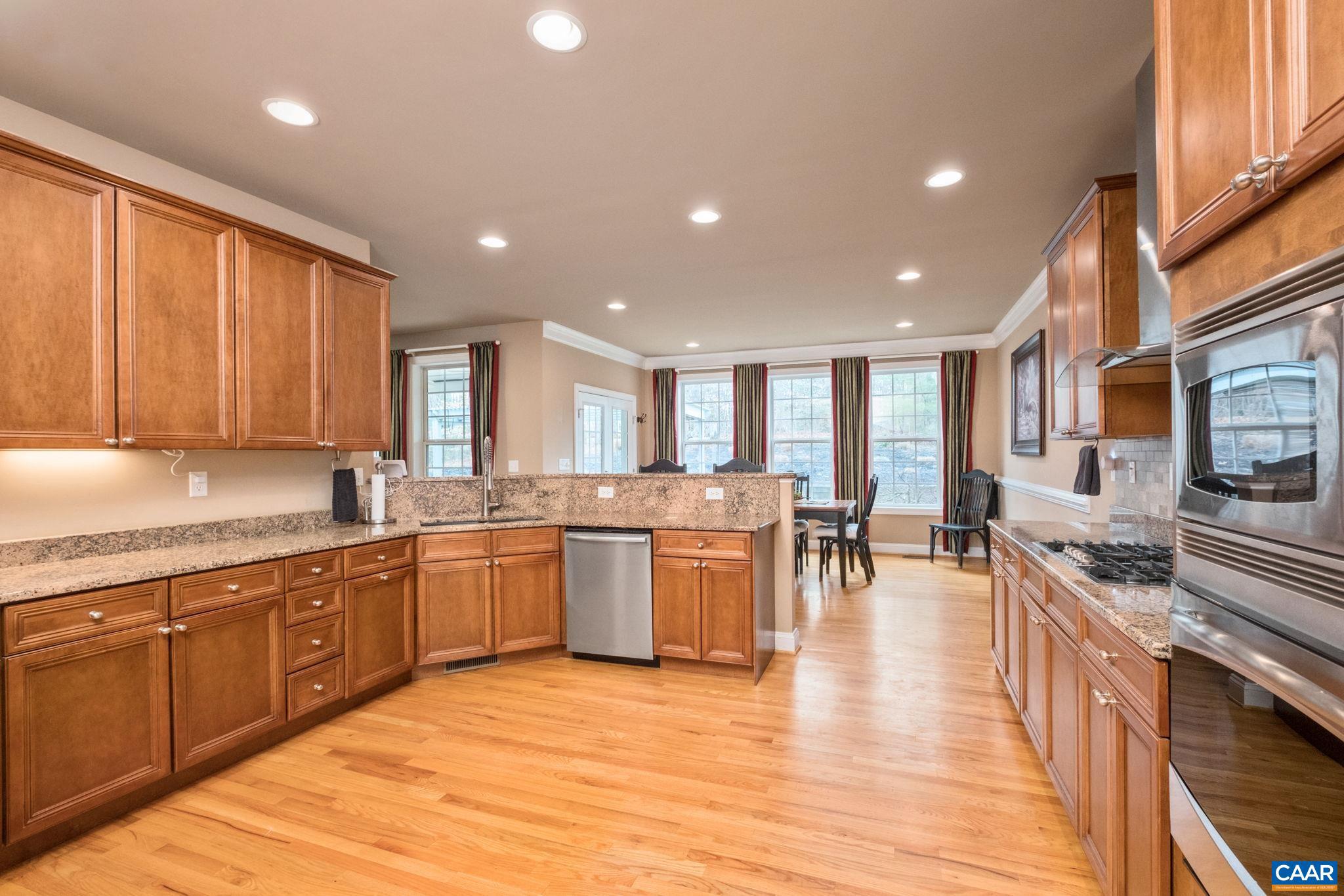 612 London Court Ruckersville, VA 22968 - Photo 20 of 55 a large kitchen with lots of counter top space and stainless steel appliances