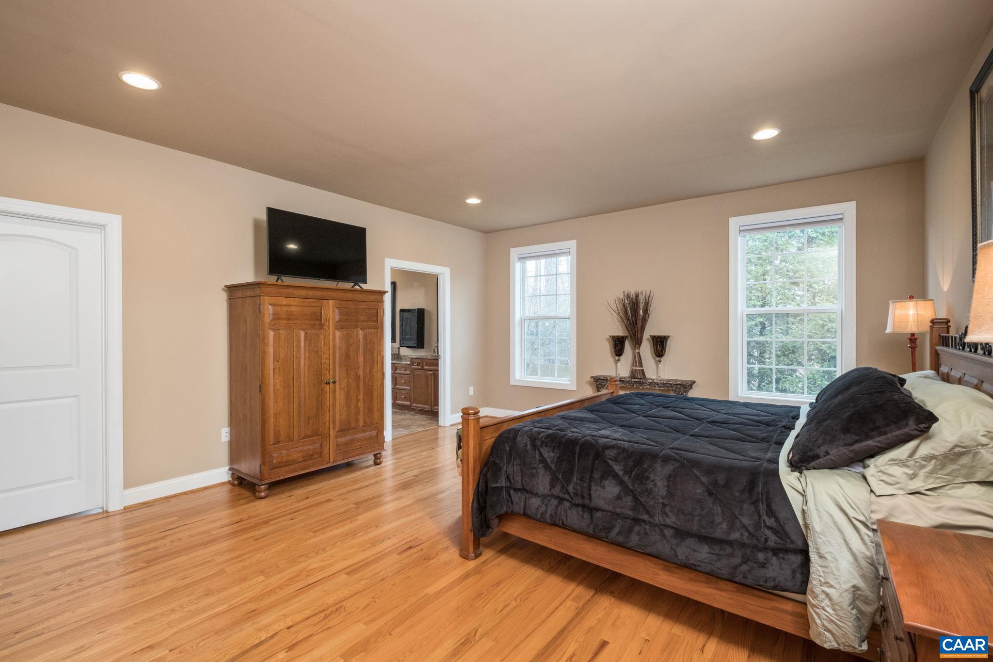612 London Court Ruckersville, VA 22968 - Photo 22 of 55 a bedroom with a bed and a television