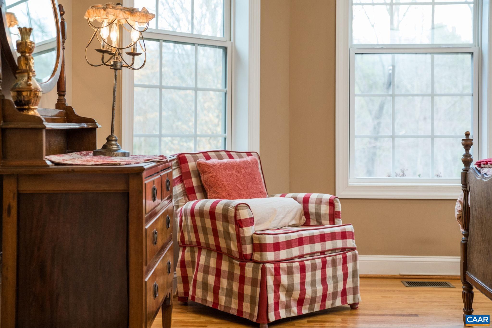 612 London Court Ruckersville, VA 22968 - Photo 30 of 55 a bedroom with a bed and wooden floor