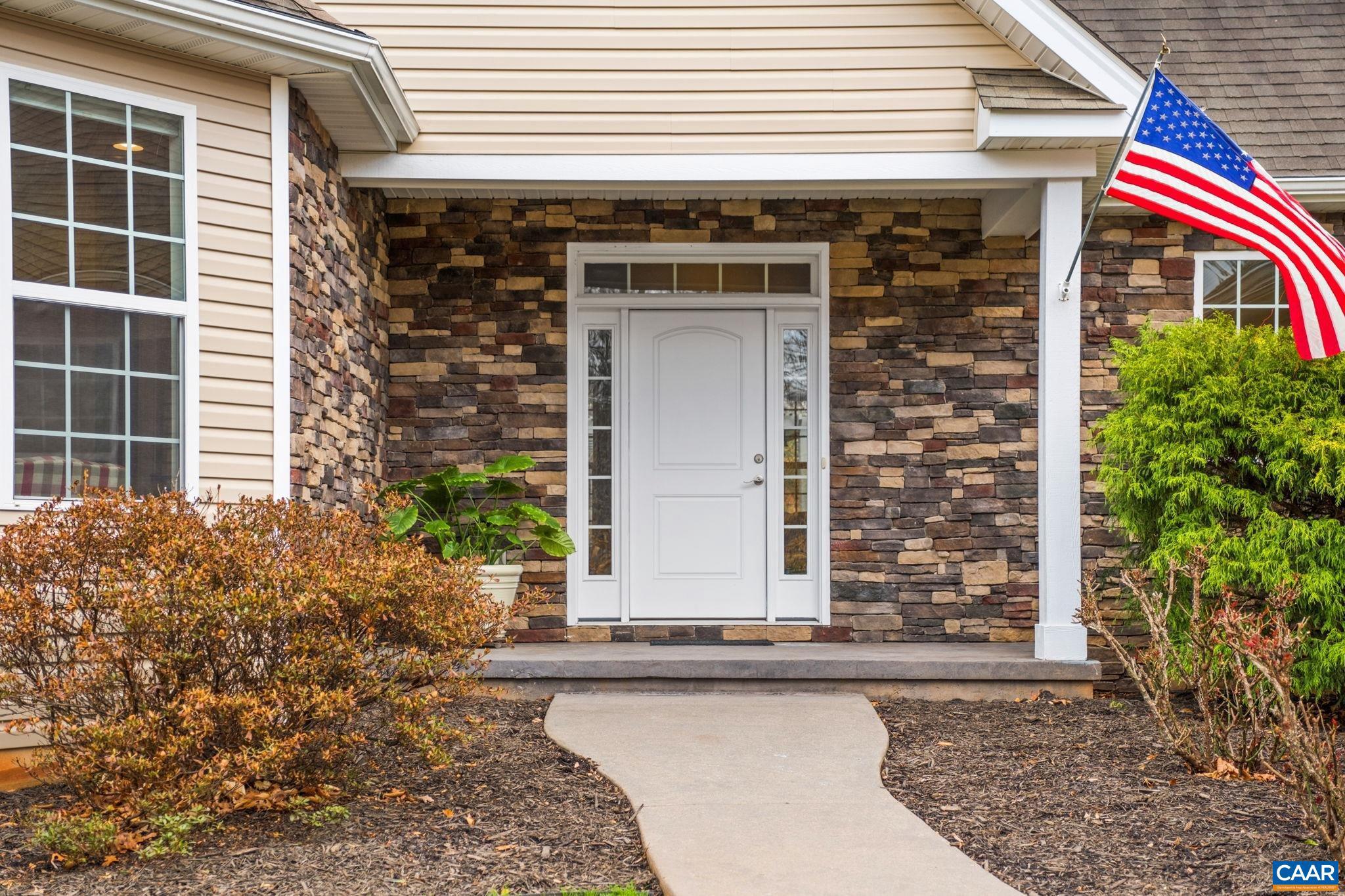 612 London Court Ruckersville, VA 22968 - Photo 3 of 55 a front view of a house with garden