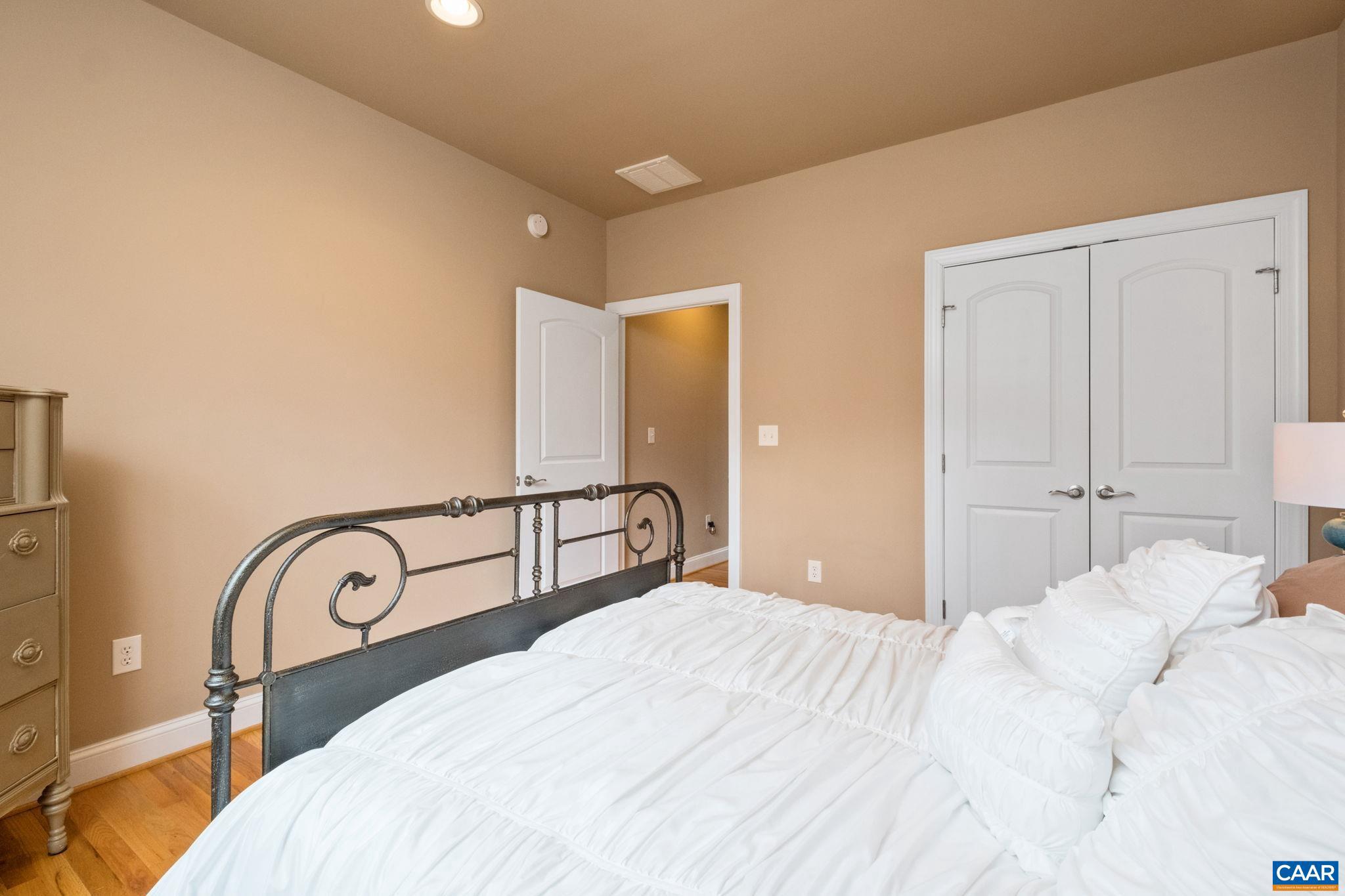 612 London Court Ruckersville, VA 22968 - Photo 36 of 55 a bedroom with a bed and a large mirror