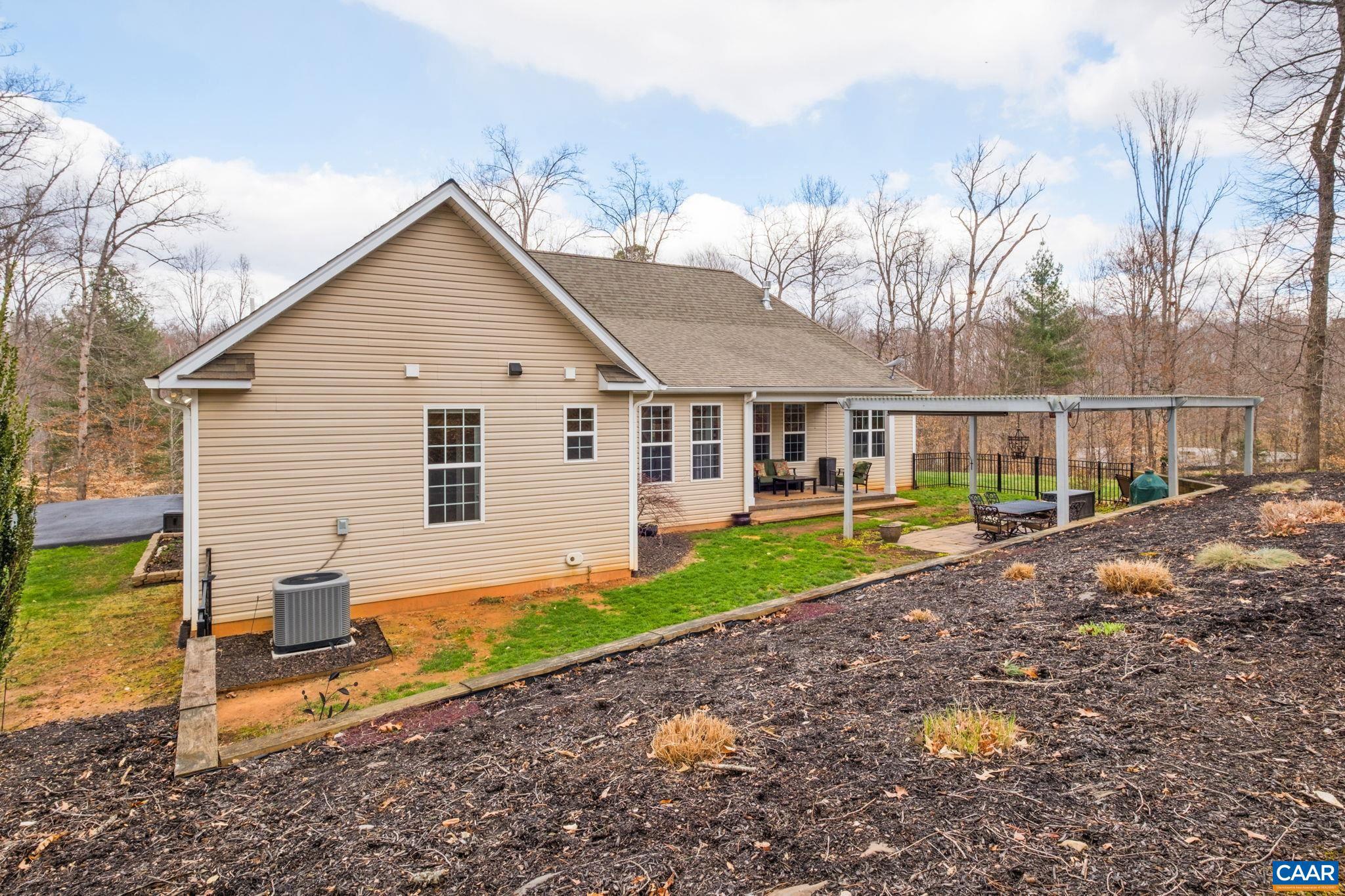 612 London Court Ruckersville, VA 22968 - Photo 40 of 55 a view of a house with backyard and sitting area