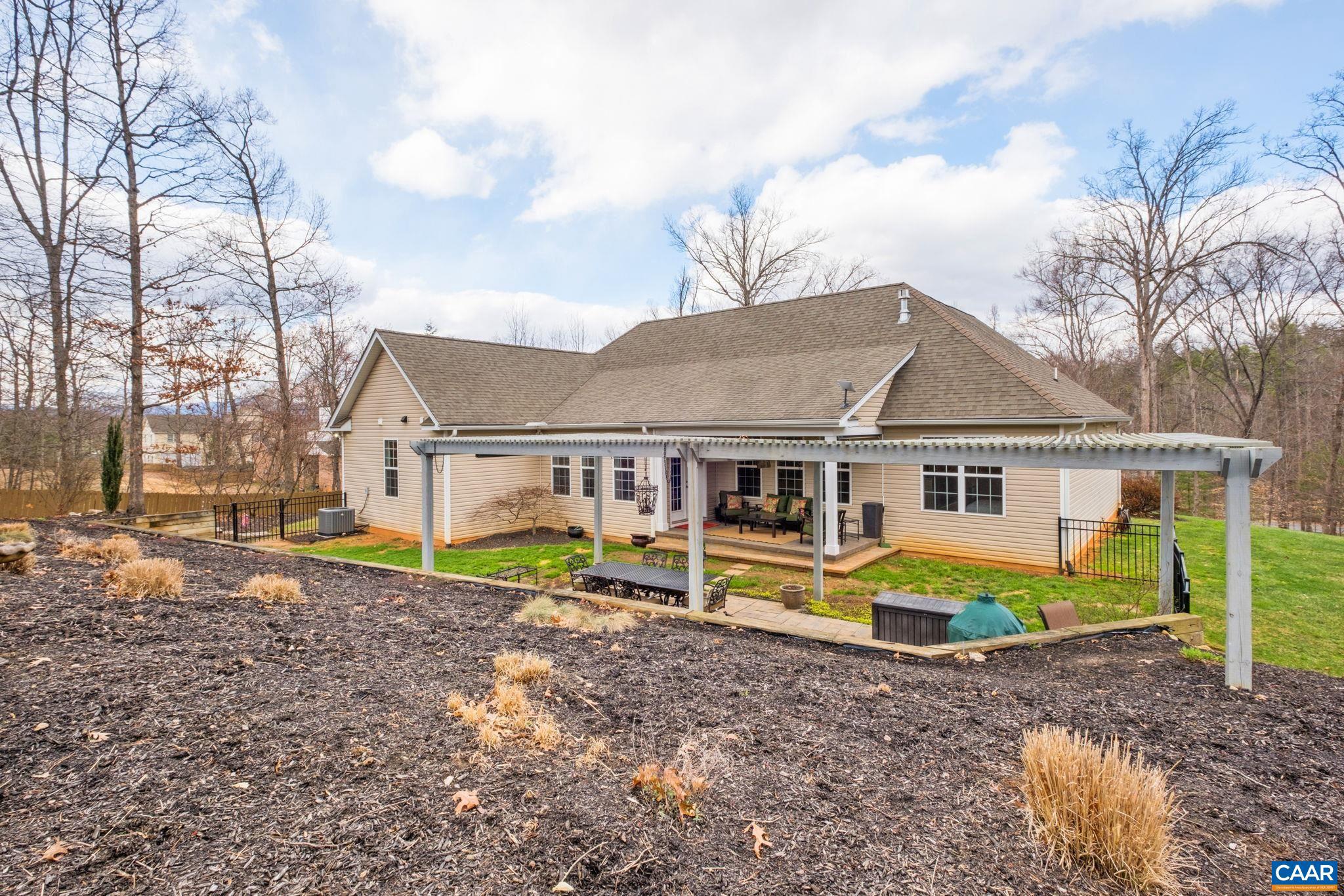 612 London Court Ruckersville, VA 22968 - Photo 41 of 55 a view of a house with a yard and roof