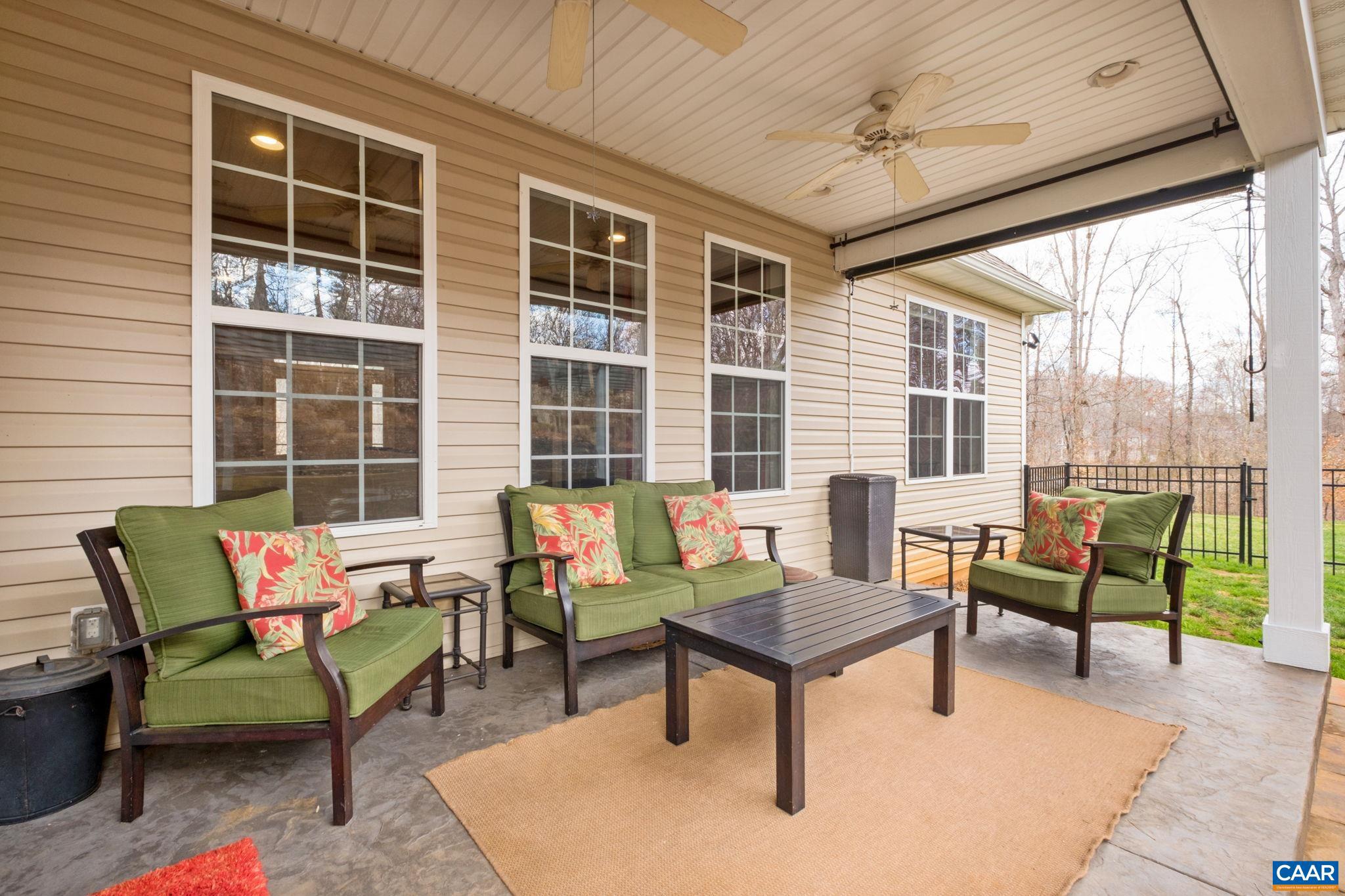 612 London Court Ruckersville, VA 22968 - Photo 42 of 55 a outdoor living space with furniture and a potted plant