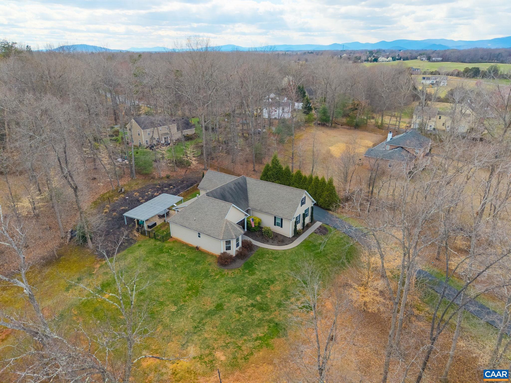 612 London Court Ruckersville, VA 22968 - Photo 53 of 55 an aerial view of a house with a yard and lake view