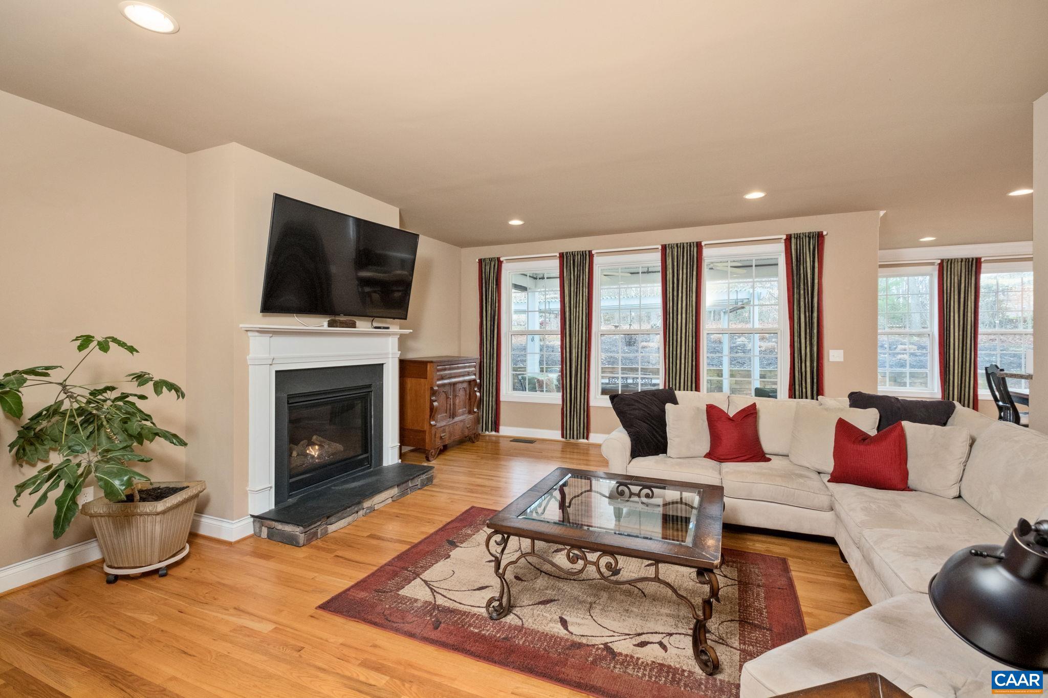 612 London Court Ruckersville, VA 22968 - Photo 8 of 55 a living room with furniture fireplace and flat screen tv