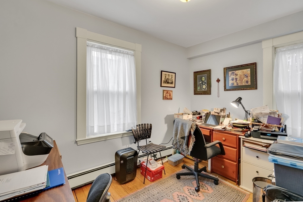 95 Cushing Street Cambridge, MA 02138 - Photo 16 of 21 a view of a workspace with a window