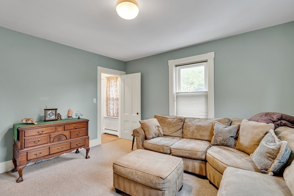 95 Cushing Street Cambridge, MA 02138 - Photo 17 of 21 a living room with furniture and a window
