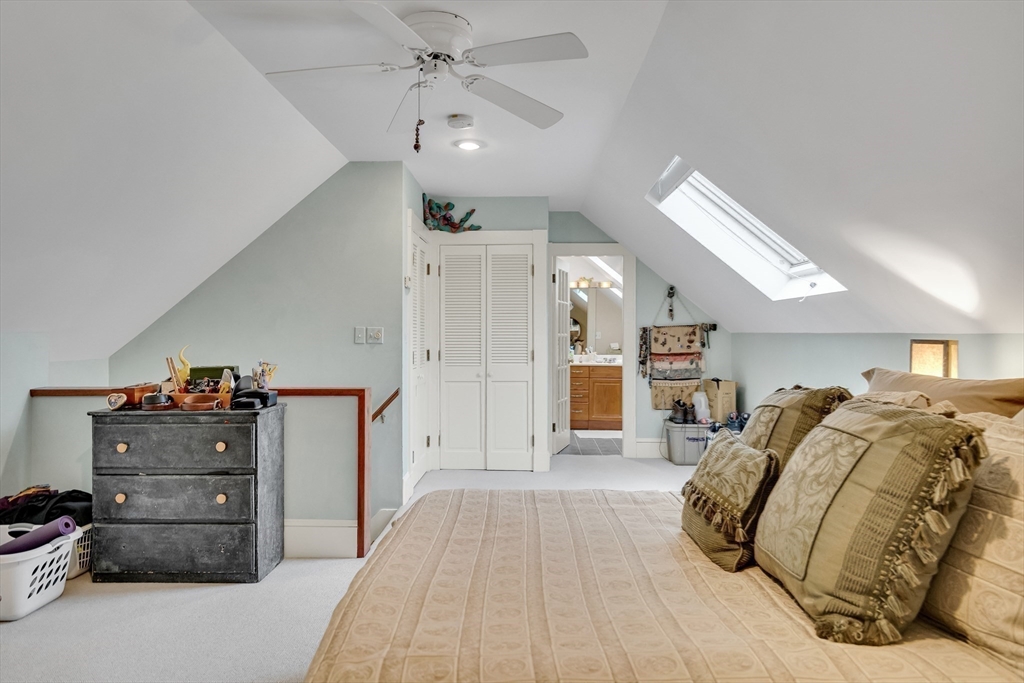 95 Cushing Street Cambridge, MA 02138 - Photo 19 of 21 a view of a bedroom with cabinets and window