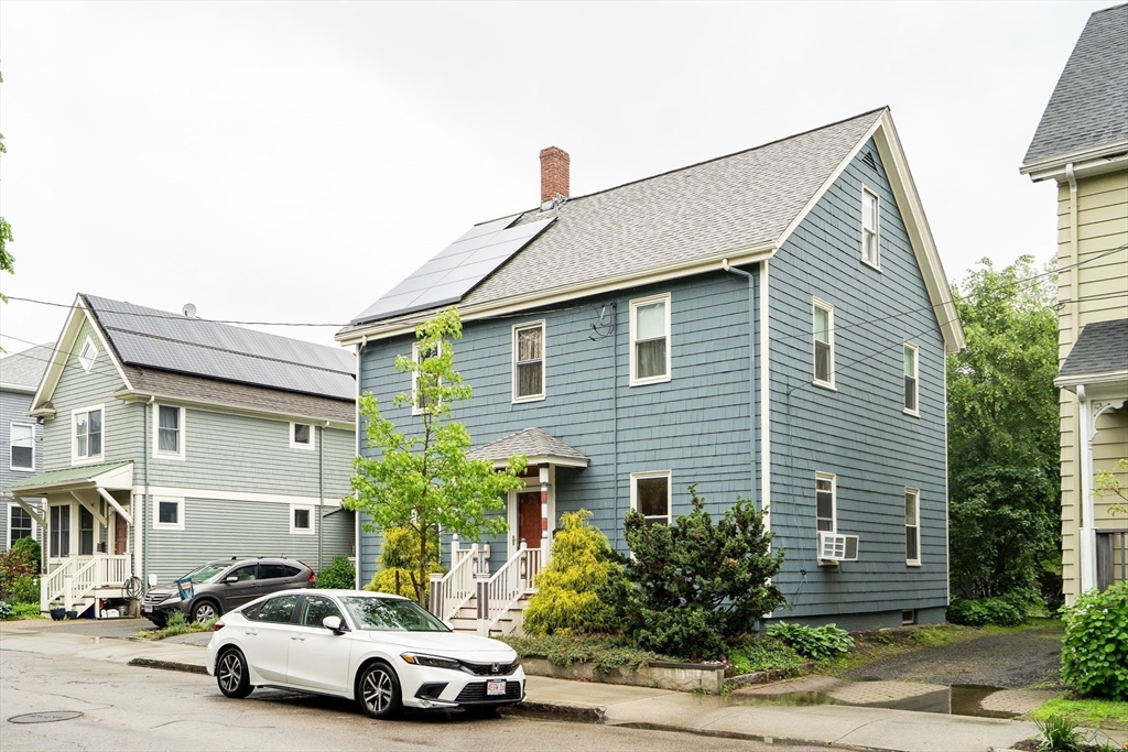 95 Cushing Street Cambridge, MA 02138 - Photo 2 of 21 a car parked in front of a white house