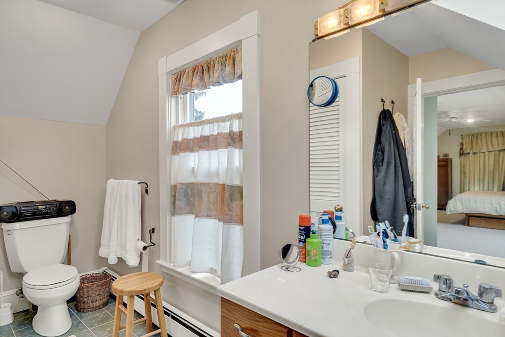 95 Cushing Street Cambridge, MA 02138 - Photo 21 of 21 a bathroom with a sink toilet and window