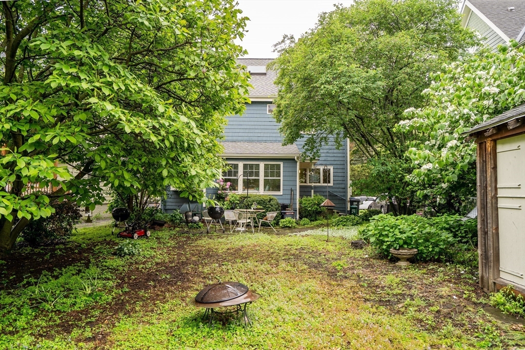 95 Cushing Street Cambridge, MA 02138 - Photo 3 of 21 a front view of a house with a yard