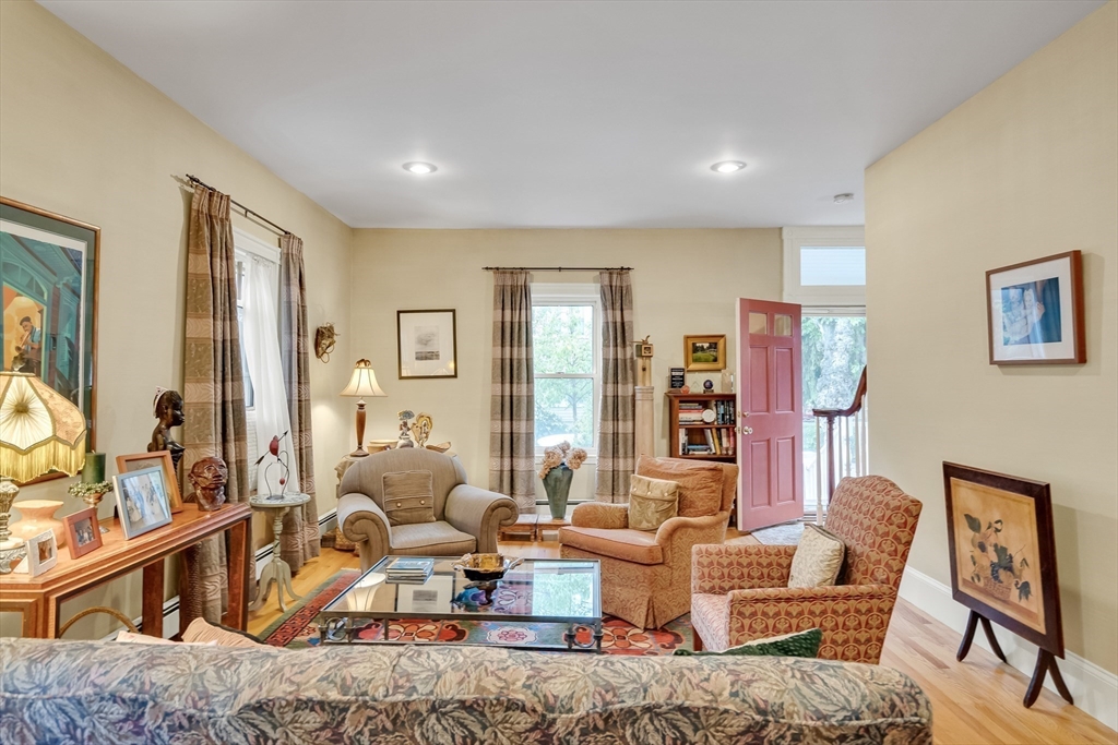 95 Cushing Street Cambridge, MA 02138 - Photo 6 of 21 a living room with furniture or couch and a large window