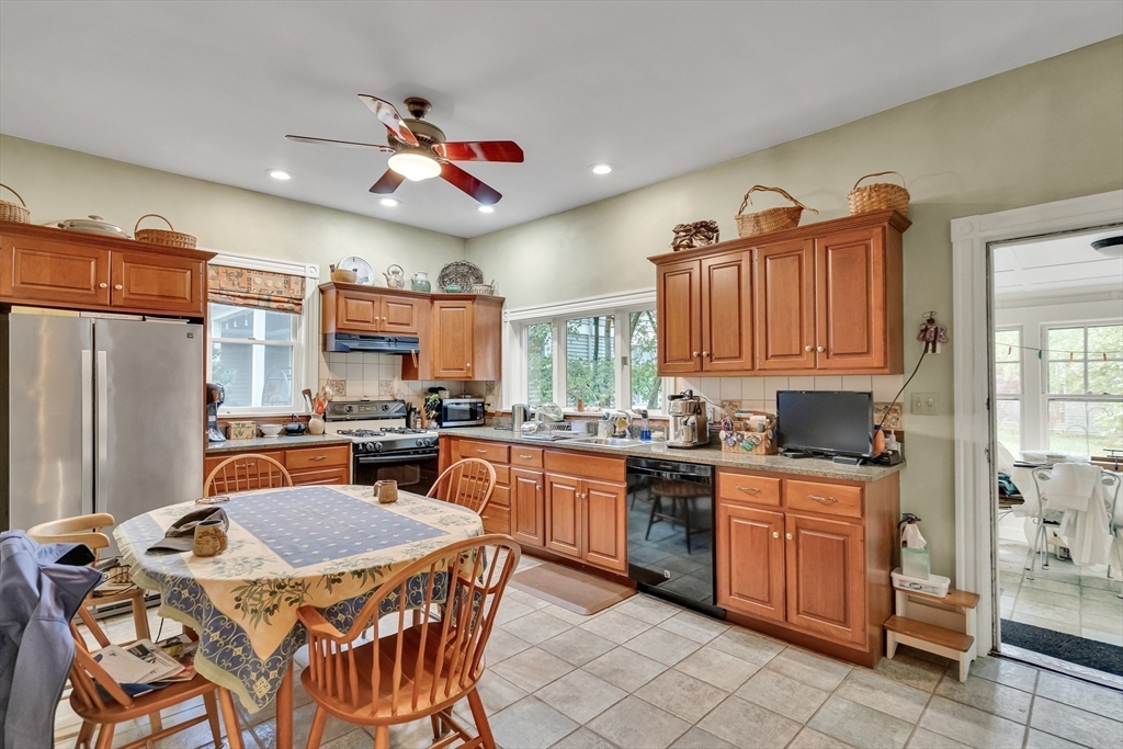 95 Cushing Street Cambridge, MA 02138 - Photo 10 of 21 a kitchen with granite countertop a sink stove and refrigerator