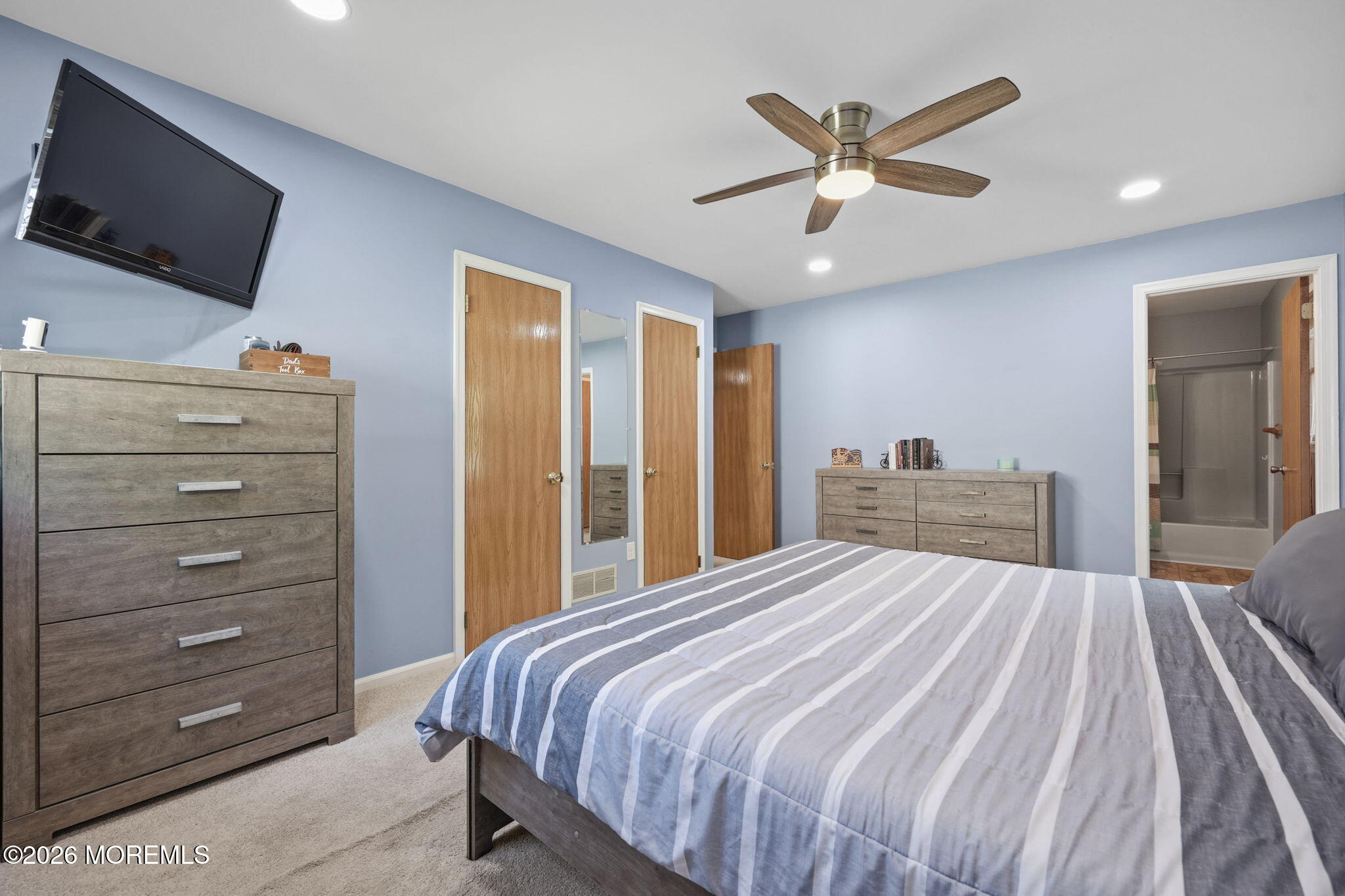356 Leesville Road Jackson, NJ 08527 - Photo 22 of 46 a bedroom with a bed and a flat screen tv