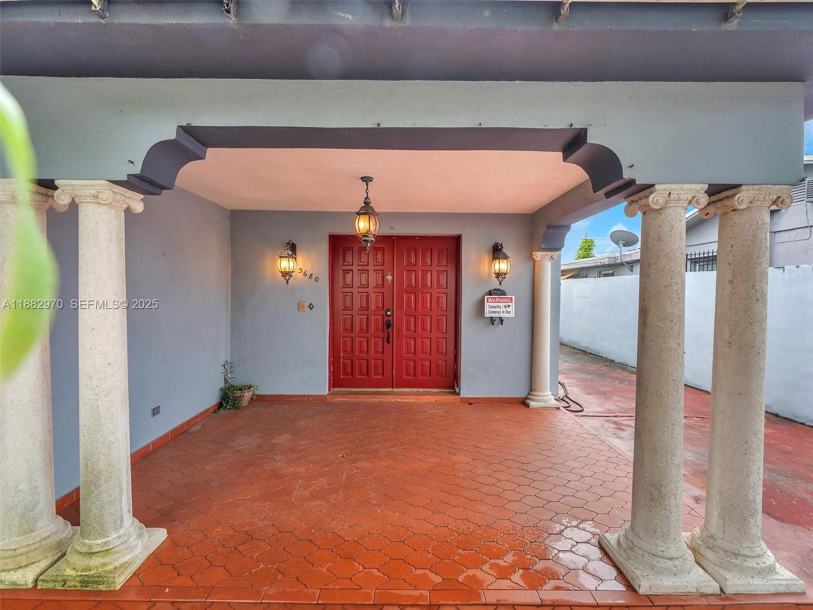 3680 Northwest 16th Street Miami, FL 33125 - Photo 1 of 45 a view of a hallway with entryway
