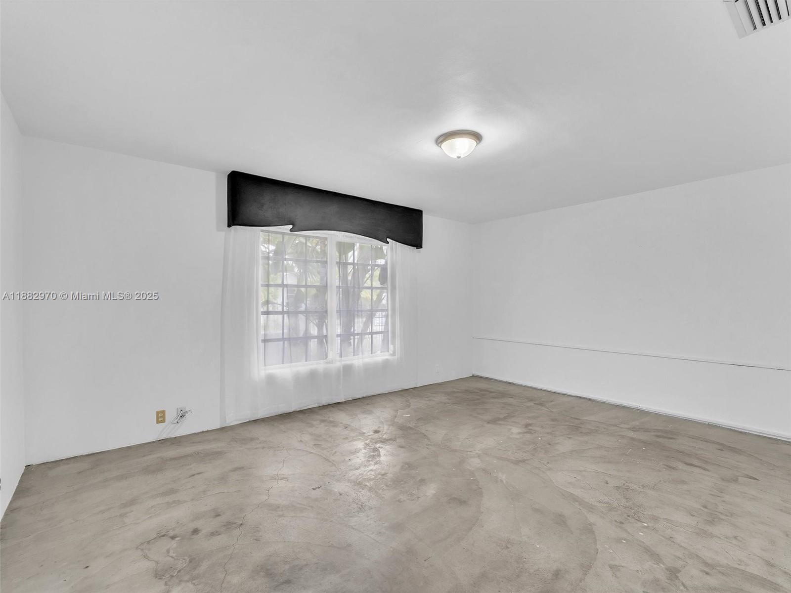 3680 Northwest 16th Street Miami, FL 33125 - Photo 17 of 45 an empty room with windows