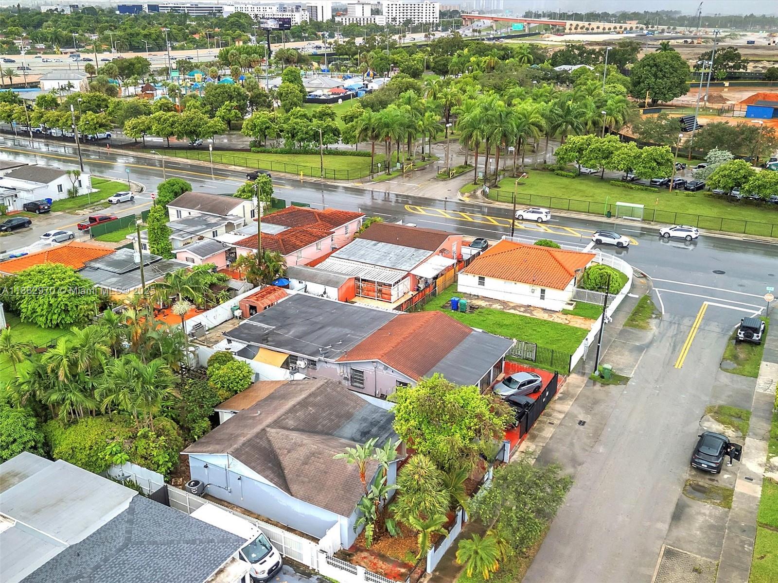3680 Northwest 16th Street Miami, FL 33125 - Photo 32 of 45 an aerial view of a house with a garden and lake view