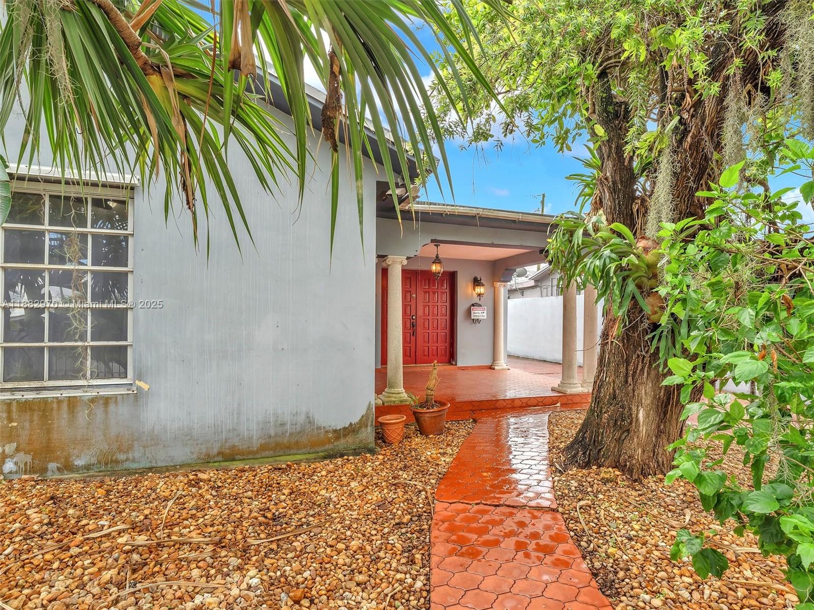 3680 Northwest 16th Street Miami, FL 33125 - Photo 7 of 45 a front view of a house