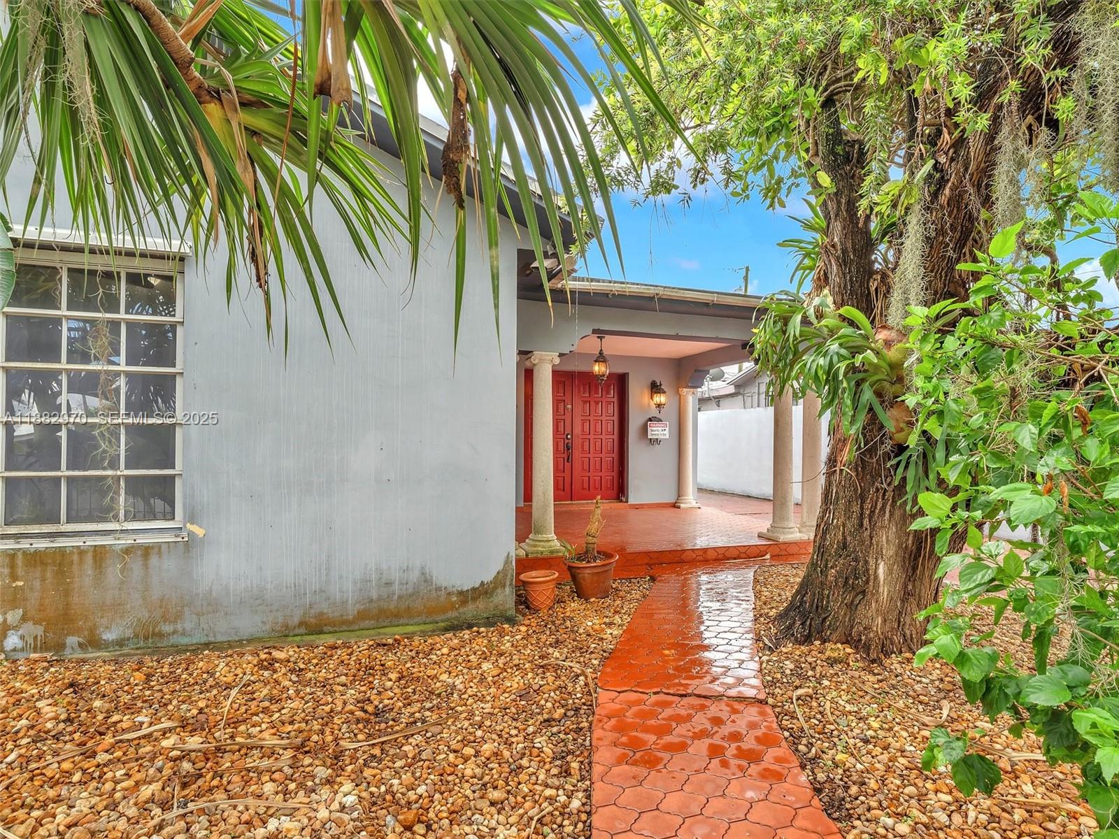 3680 Northwest 16th Street Miami, FL 33125 - Photo 7 of 45 a front view of a house