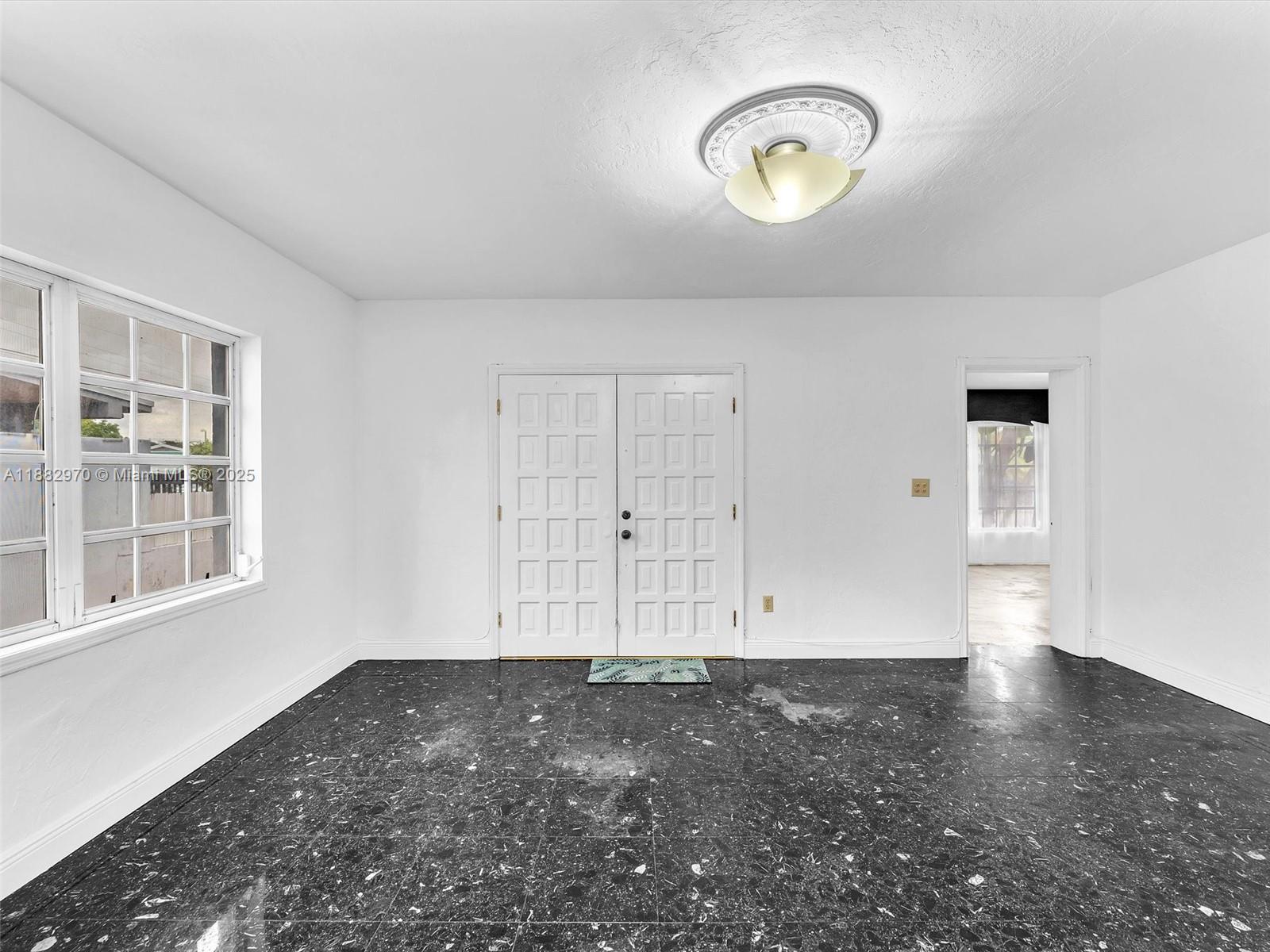 3680 Northwest 16th Street Miami, FL 33125 - Photo 9 of 45 en empty room with window