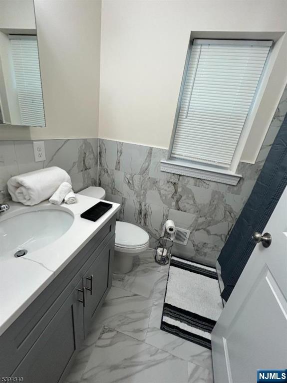337 13th Avenue Newark, NJ 07103 - Photo 10 of 14 a bathroom with a sink and a mirror