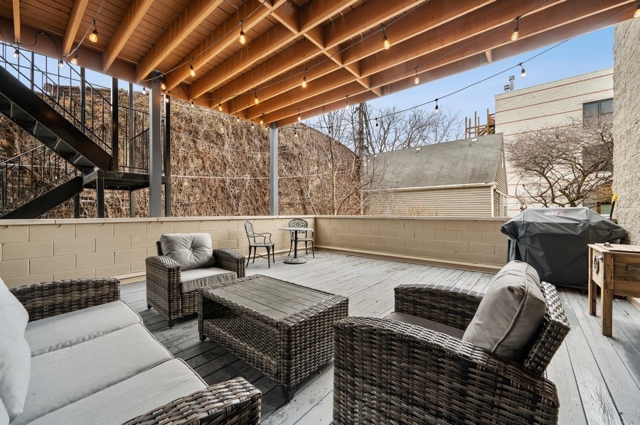 2919 North Burling Street, Unit D Chicago, IL 60657 - Photo 12 of 14 a outdoor living space with patio furniture
