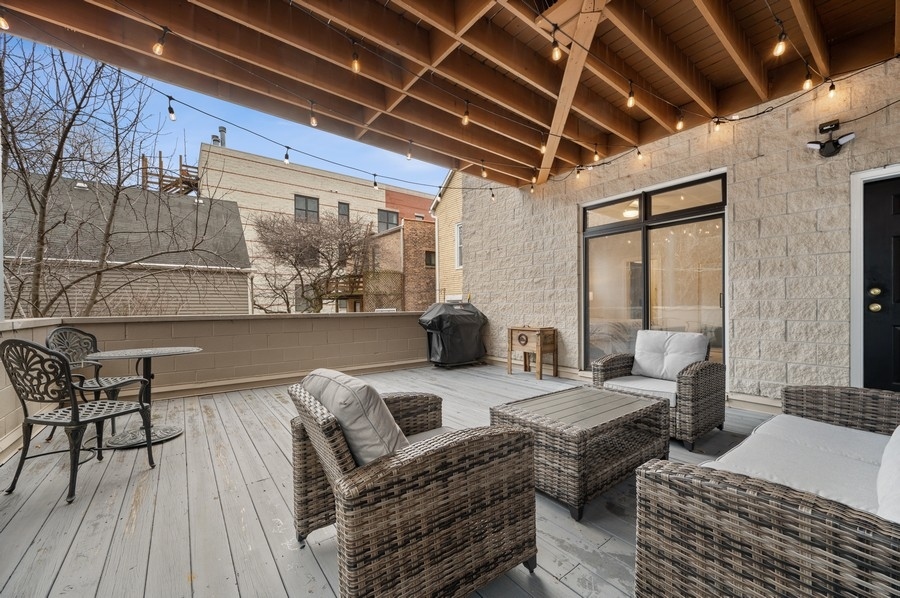 2919 North Burling Street, Unit D Chicago, IL 60657 - Photo 13 of 14 a outdoor living space with furniture and a couch