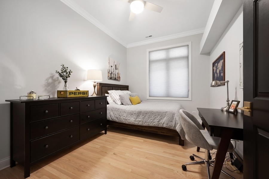 2919 North Burling Street, Unit D Chicago, IL 60657 - Photo 9 of 14 a bedroom with a bed and furniture