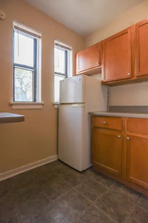 a view of kitchen with a refrigerator cabinet and a refrigerator