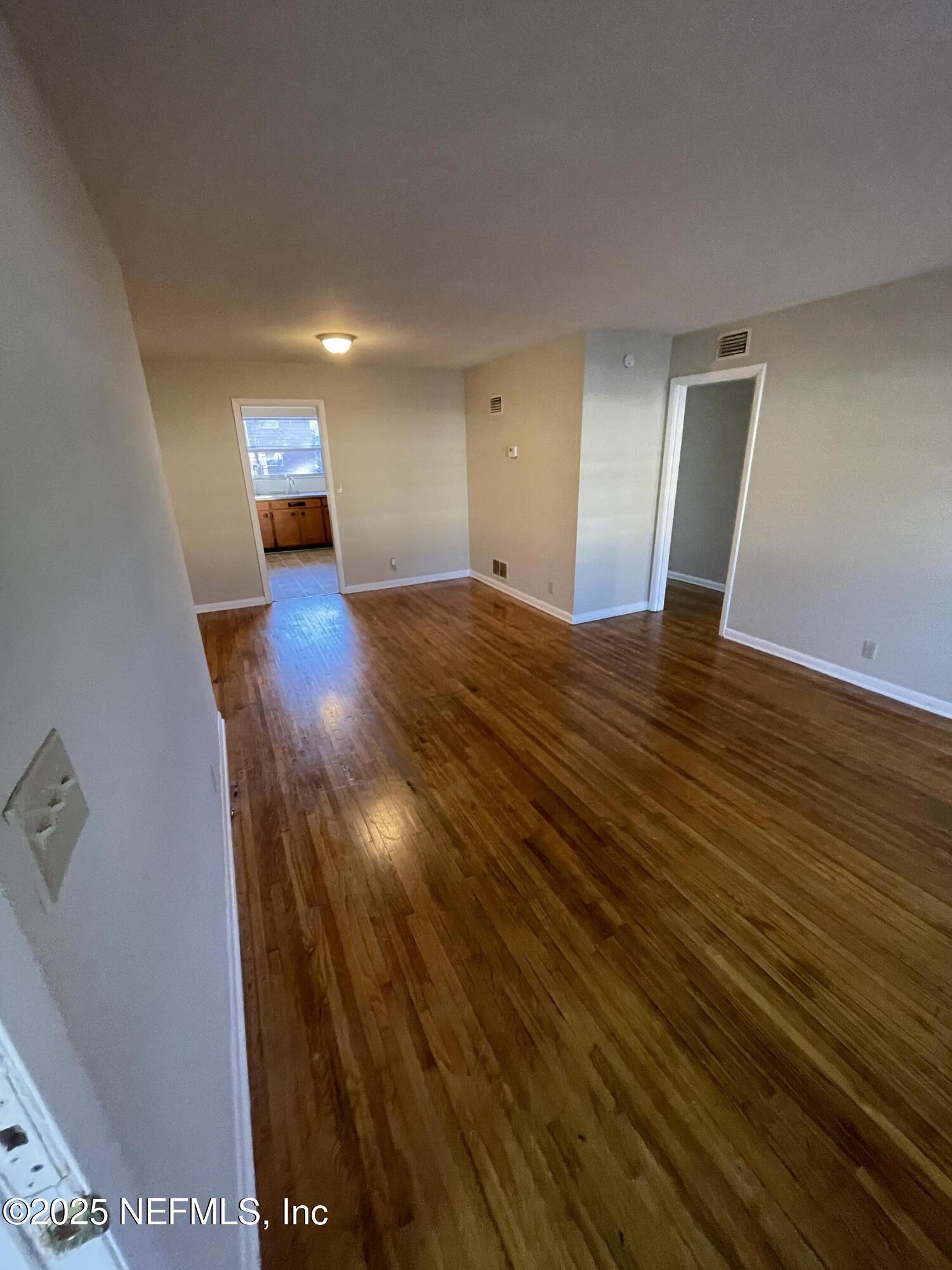 5452 Santa Rosa Way, Unit 4 Jacksonville, FL 32211 - Photo 2 of 6 a view of empty room with wooden floor