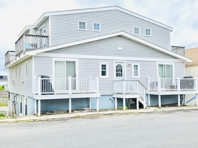 a front view of a house with a street