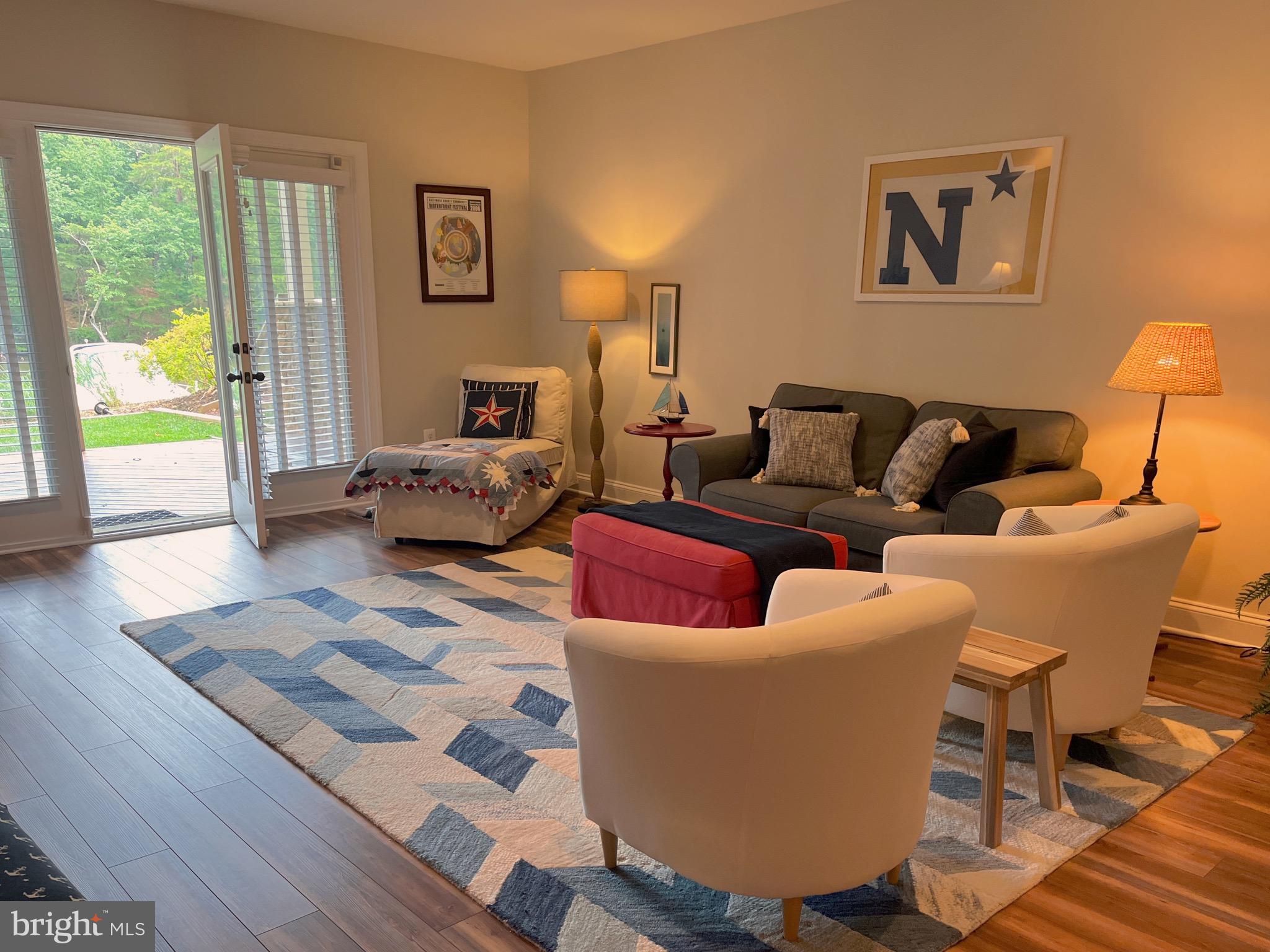 186 Acton Road Annapolis, MD 21403 - Photo 13 of 19 Family room with deck access & view of Spa Creek