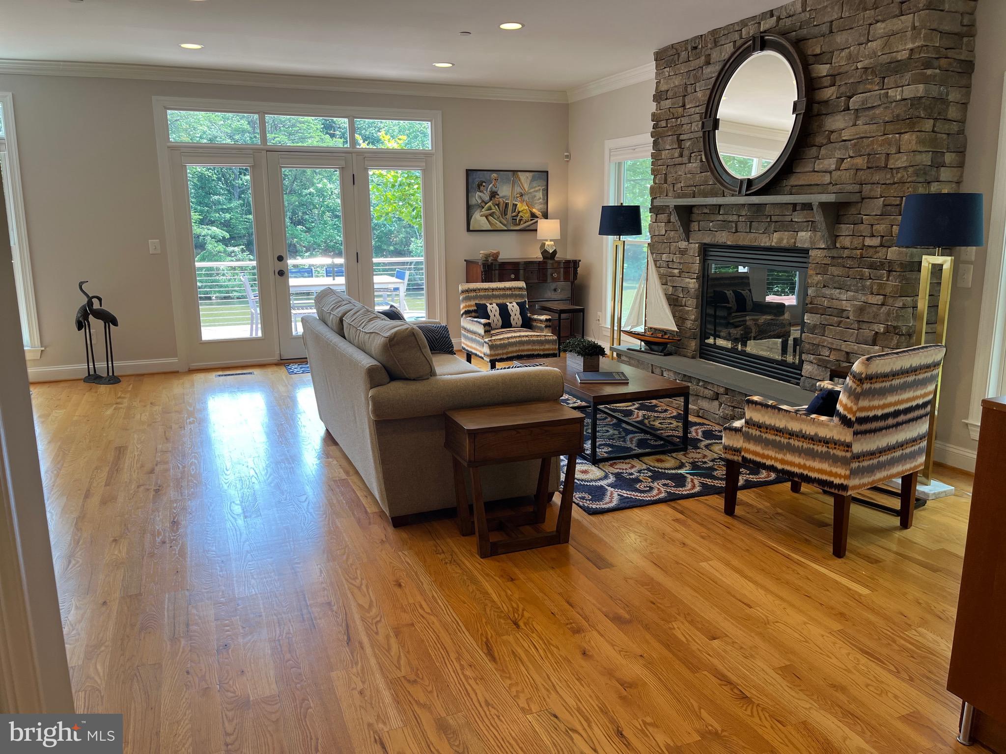 186 Acton Road Annapolis, MD 21403 - Photo 9 of 19 Great room living area to deck & view of Spa Creek