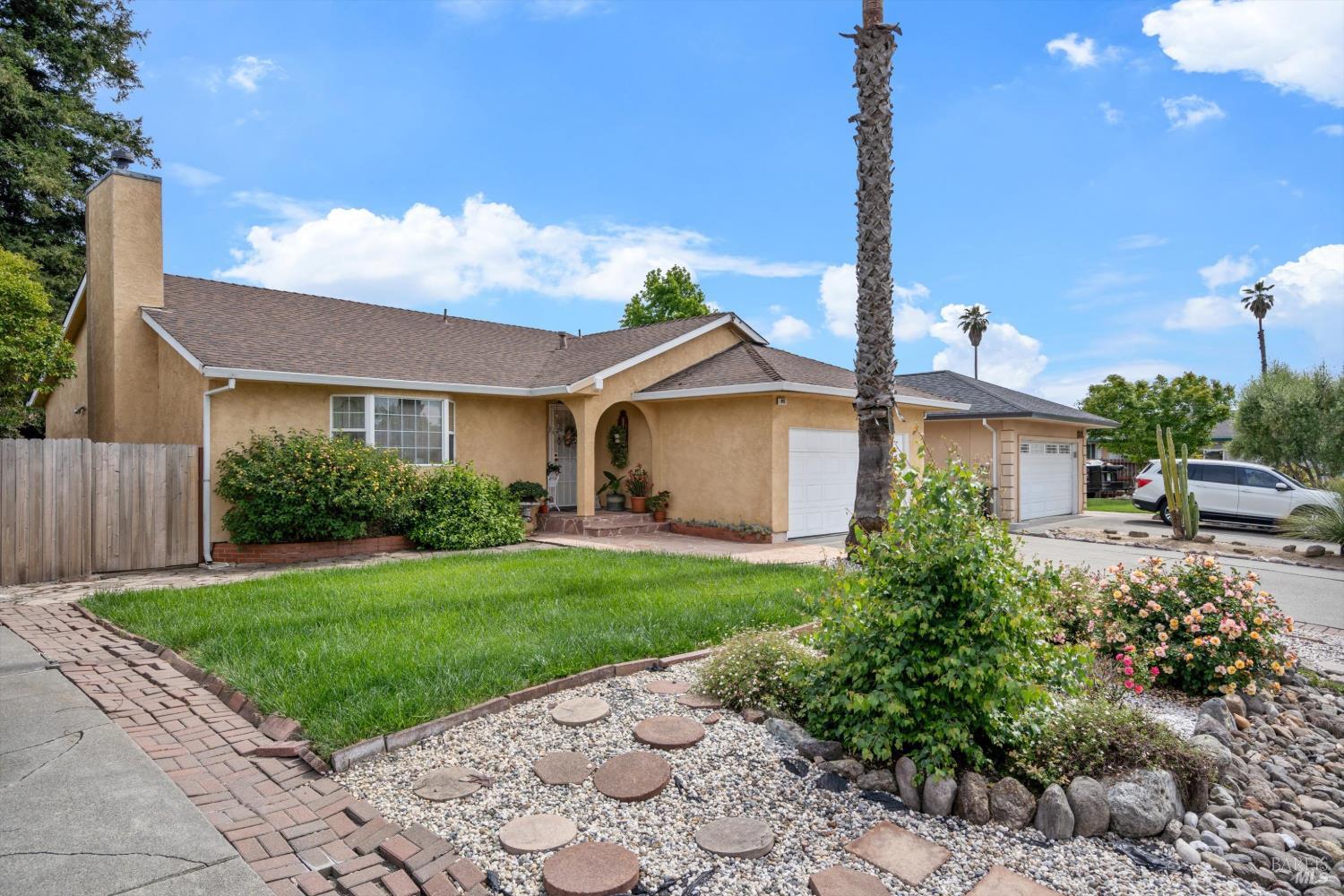 971 Eleanor Avenue Rohnert Park, CA 94928 - Photo 5 of 25 a front view of a house with garden