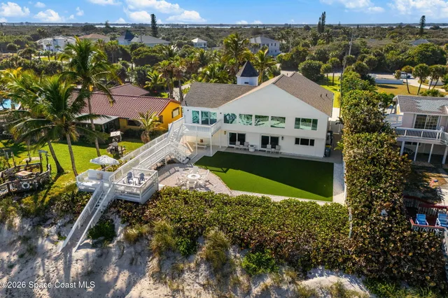 a bedroom with a bed mirror and window