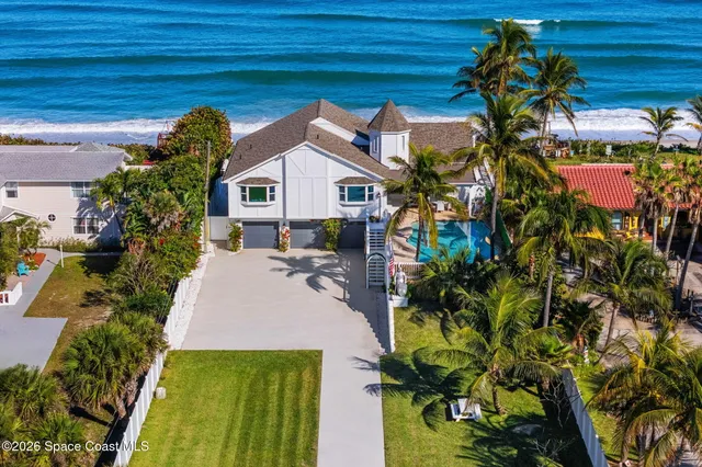 a view of a balcony next to a yard