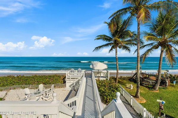a view of houses with outdoor space and ocean view