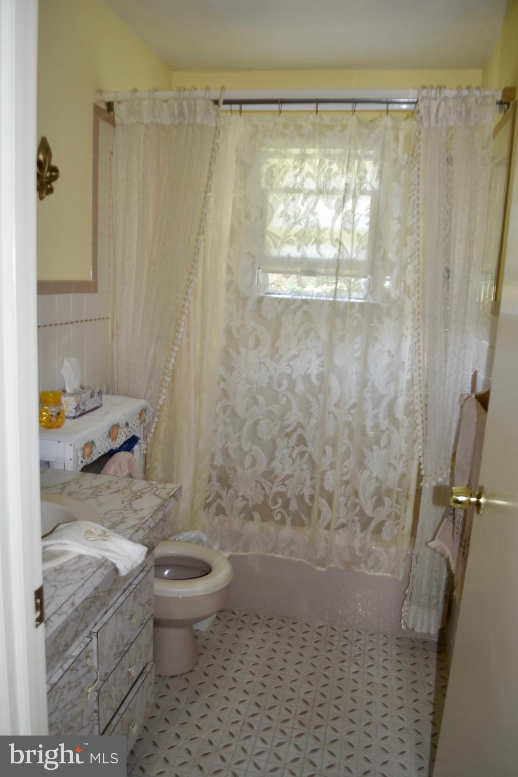 509 Walker Avenue Ewing, NJ 08628 - Photo 12 of 20 a bathroom with a granite countertop shower a toilet and a shower