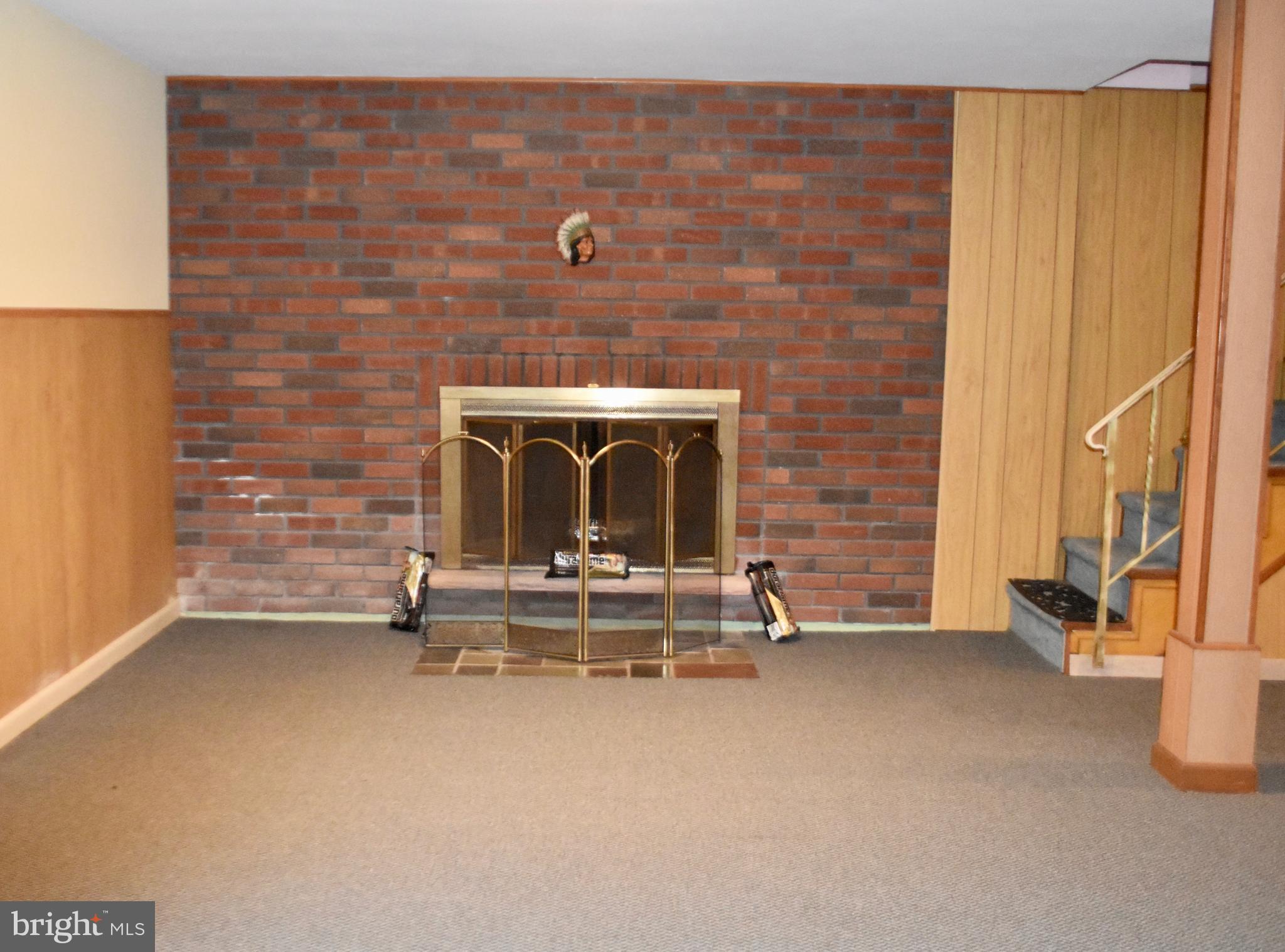 509 Walker Avenue Ewing, NJ 08628 - Photo 14 of 20 a view of an empty room with a fireplace