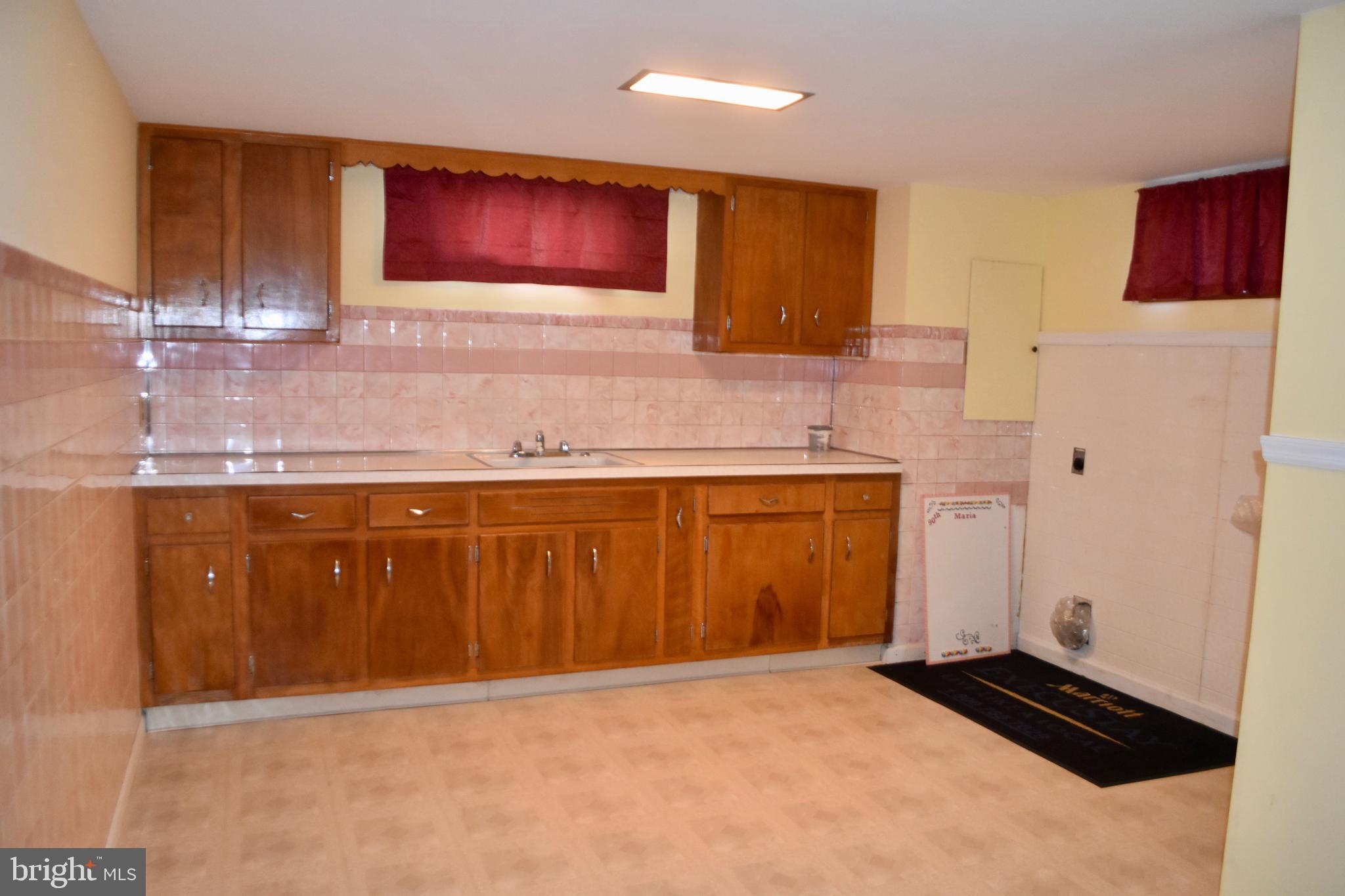 509 Walker Avenue Ewing, NJ 08628 - Photo 15 of 20 a kitchen with a sink a stove and cabinets